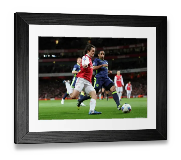 Framed Print : Arsenal's Rosicky Faces Off Against Wigan's Beausejour in Intense Premier League Clash Framed Print : Arsenal's Rosicky Faces Off Against Wigan's Beausejour in Intense Premier League Clash