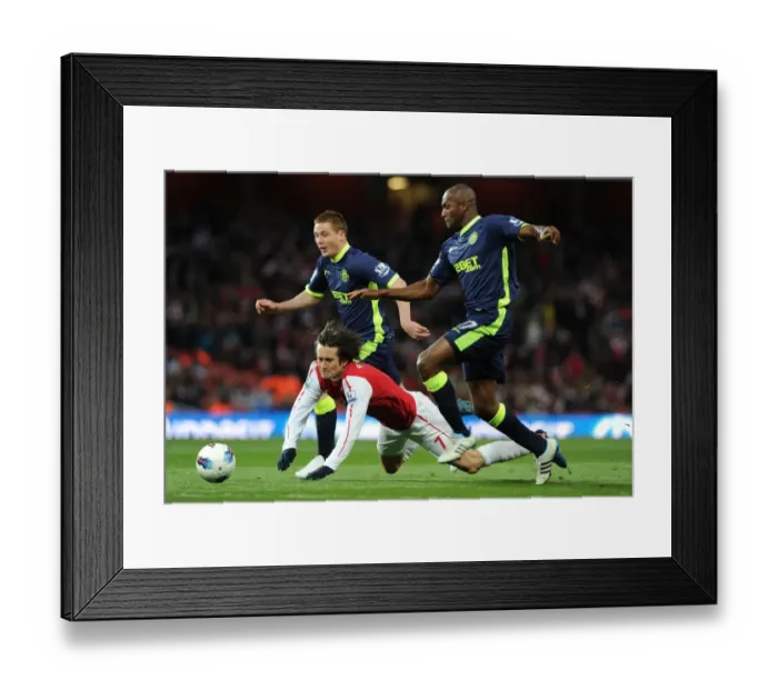 Framed Print : Arsenal's Rosicky Fouls by Wigan's Boyce in Premier League Clash (2012) Framed Print : Arsenal's Rosicky Fouls by Wigan's Boyce in Premier League Clash (2012)