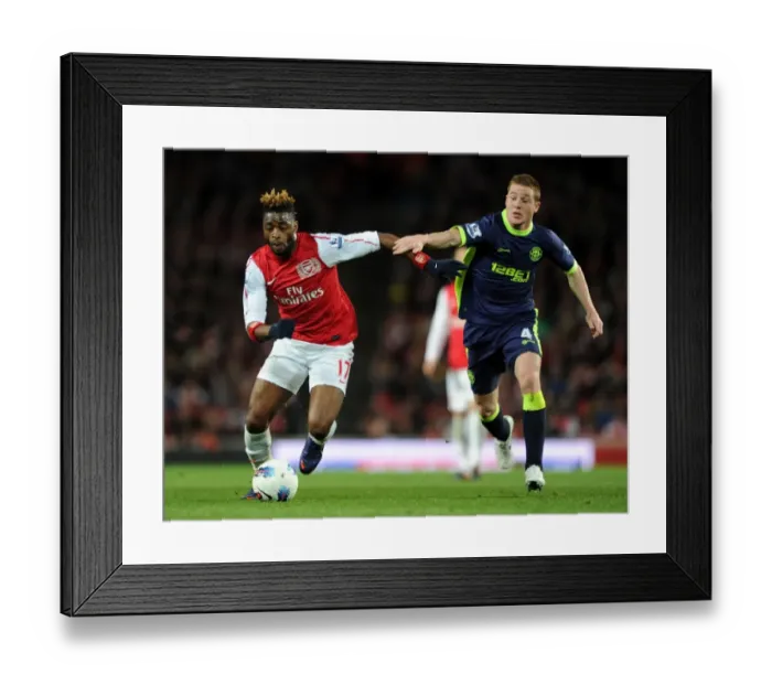 Framed Print : Clash of Midfielders: Alex Song vs. James McCarthy - Arsenal v Wigan Athletic, Premier League 2011-12 Framed Print : Clash of Midfielders: Alex Song vs. James McCarthy - Arsenal v Wigan Athletic, Premier League 2011-12