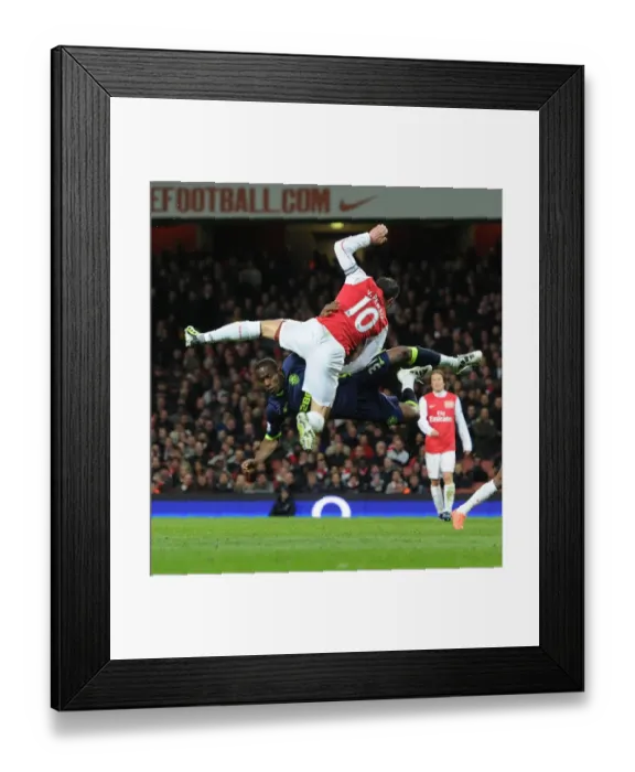 Framed Print : Arsenal vs. Wigan: Van Persie vs. Figueroa in Intense Battle Framed Print : Arsenal vs. Wigan: Van Persie vs. Figueroa in Intense Battle