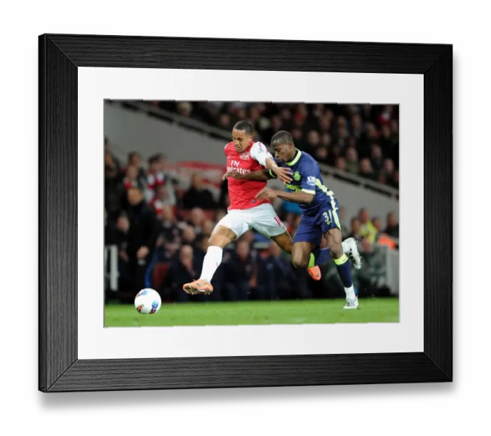 Framed Print : Theo Walcott vs. Maynor Figueroa: Battle at Emirates Stadium - Arsenal v Wigan Athletic, Premier League 2011-12 Framed Print : Theo Walcott vs. Maynor Figueroa: Battle at Emirates Stadium - Arsenal v Wigan Athletic, Premier League 2011-12
