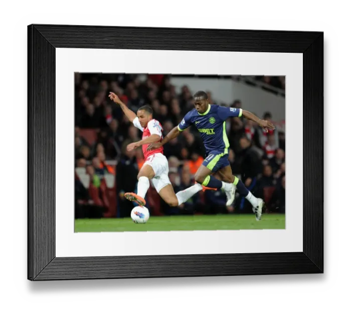 Framed Print : Theo Walcott vs. Maynor Figueroa: A Fierce Rivalry Unfolds at Emirates Stadium (Arsenal vs. Wigan Athletic, 2012)