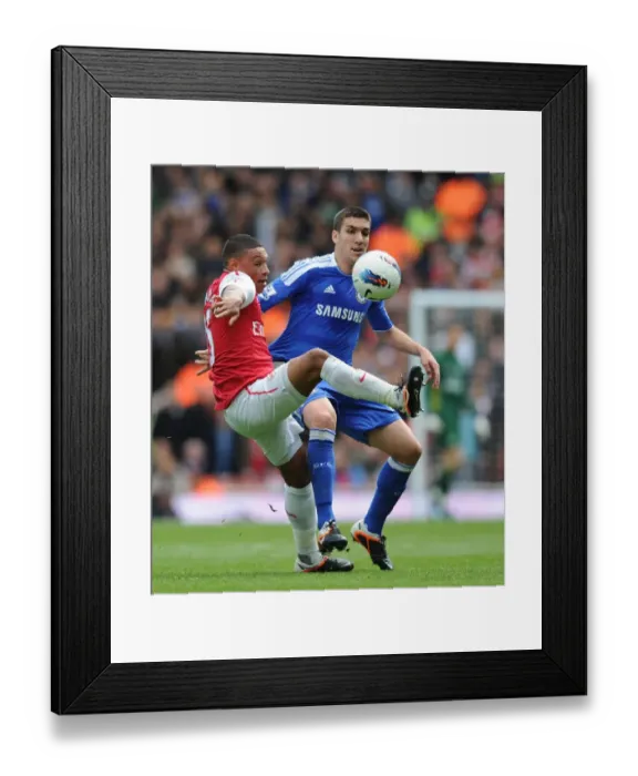 Framed Print : Battle of the Midfield: Oxlade-Chamberlain vs. Romeu in Arsenal vs. Chelsea Clash Framed Print : Battle of the Midfield: Oxlade-Chamberlain vs. Romeu in Arsenal vs. Chelsea Clash