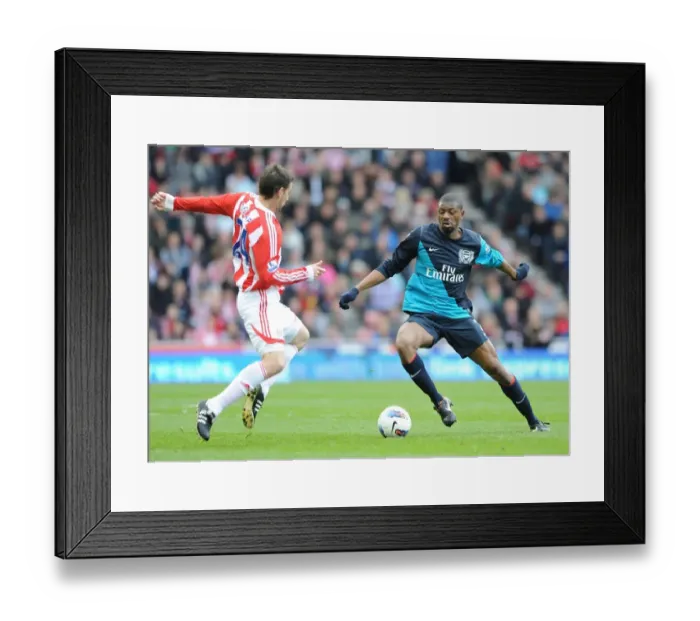Framed Print : Clash of Styles: Abou Diaby vs. Rory Delap - Stoke City vs. Arsenal, Premier League