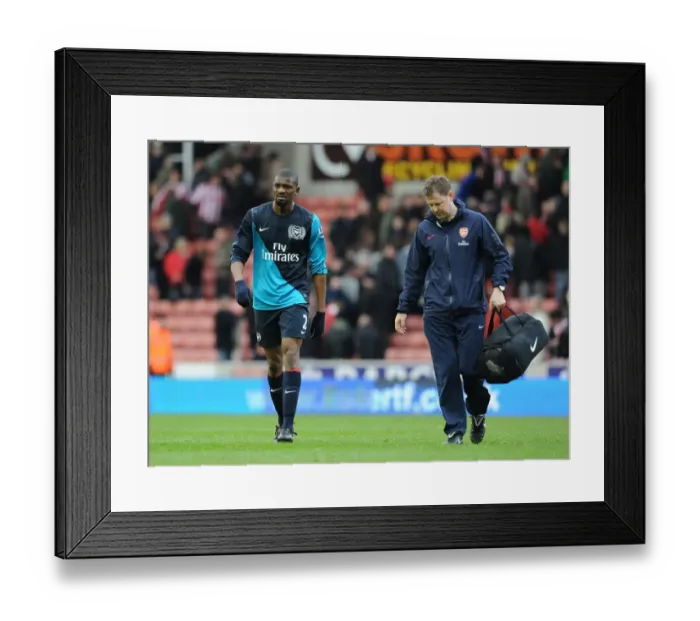 Framed Print : Arsenal's Colin Lewin Tends to Injured Abou Diaby vs Stoke City (2012) Framed Print : Arsenal's Colin Lewin Tends to Injured Abou Diaby vs Stoke City (2012)