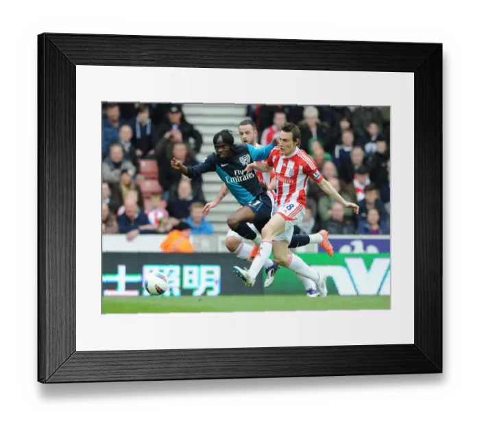 Framed Print : Gervinho vs Wilson and Whitehouse: Intense Battle at Stoke City vs Arsenal (2011-12) Framed Print : Gervinho vs Wilson and Whitehouse: Intense Battle at Stoke City vs Arsenal (2011-12)