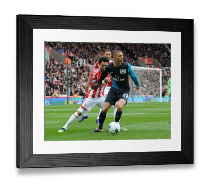 Framed Print : Clash of Wings: Gibbs vs Pennant in Stoke City vs Arsenal Framed Print : Clash of Wings: Gibbs vs Pennant in Stoke City vs Arsenal