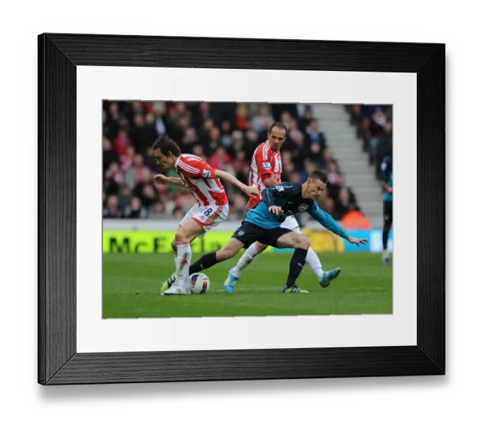 Framed Print : Koscielny vs. Whitehead: Intense Battle in Stoke City vs. Arsenal (2011-12)