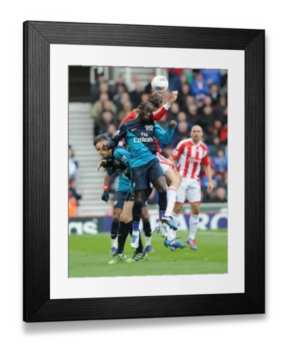 Framed Print : Sagna vs. Crouch: Intense Battle in Stoke City vs. Arsenal (2011-12) Framed Print : Sagna vs. Crouch: Intense Battle in Stoke City vs. Arsenal (2011-12)