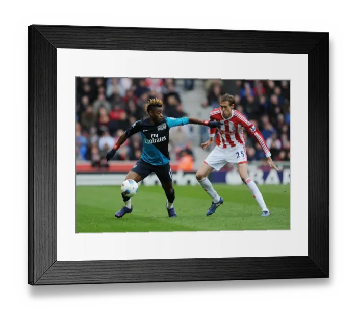 Framed Print : Clash of Titans: Alex Song vs. Peter Crouch - Stoke City vs. Arsenal, Premier League, 2012 Framed Print : Clash of Titans: Alex Song vs. Peter Crouch - Stoke City vs. Arsenal, Premier League, 2012