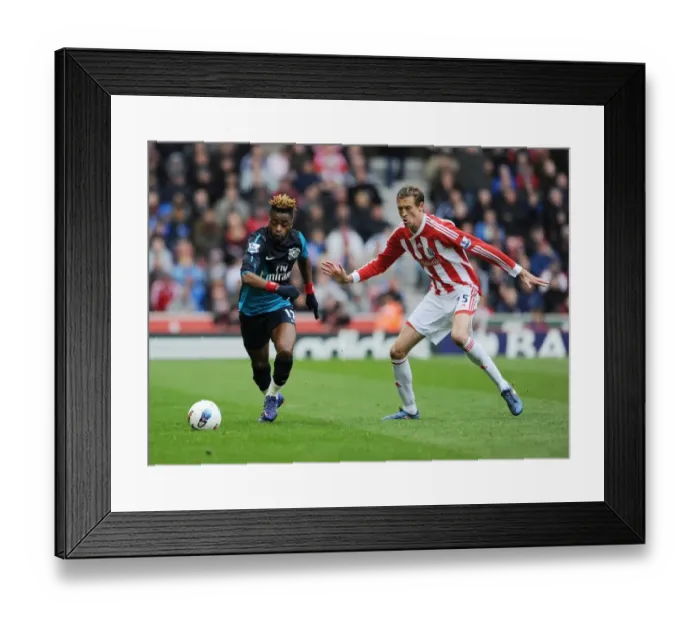 Framed Print : Clash of Titans: Alex Song vs. Peter Crouch - Arsenal vs. Stoke City, Premier League, 2011-2012