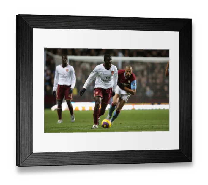 Framed Print : Kolo Toure (Arsenal) John Carew (Aston Villa)