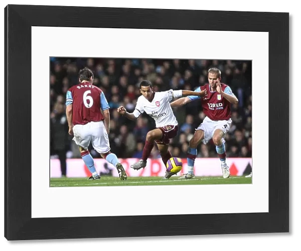 Theo Walcott (Arsenal) Olof Mellberg and Gareth Barry (Aston Villa)