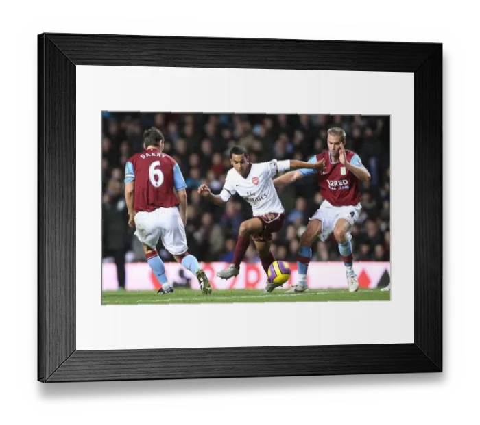 Framed Print : Theo Walcott (Arsenal) Olof Mellberg and Gareth Barry (Aston Villa) Framed Print : Theo Walcott (Arsenal) Olof Mellberg and Gareth Barry (Aston Villa)