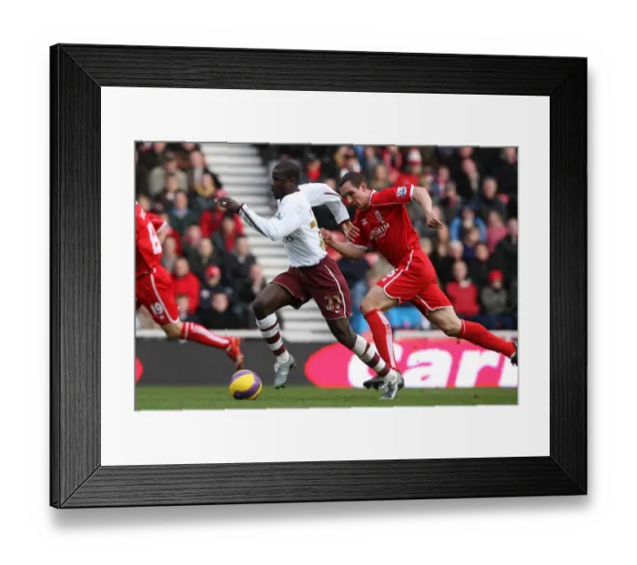 Framed Print : Emmanuel Eboue (Arsenal) Emanuel Pogatetz (Middlesbrough) Framed Print : Emmanuel Eboue (Arsenal) Emanuel Pogatetz (Middlesbrough)