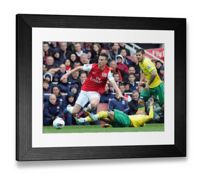 Framed Print : Arsenal's Koscielny Fouls by Norwich's Jackson in 2011-12 Premier League Clash Framed Print : Arsenal's Koscielny Fouls by Norwich's Jackson in 2011-12 Premier League Clash
