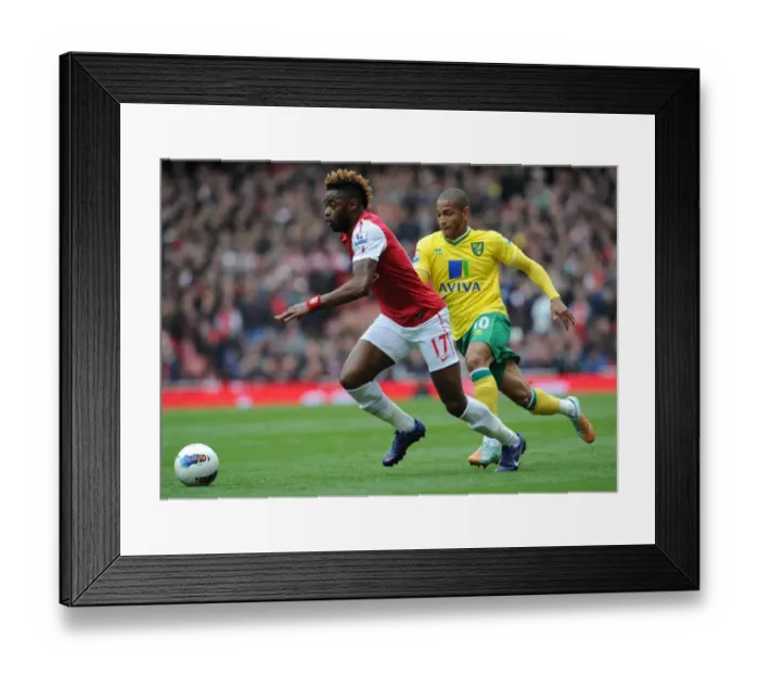 Framed Print : Clash of Forces: Alex Song vs. Simon Jackson - Arsenal vs. Norwich City, Premier League, 2012 Framed Print : Clash of Forces: Alex Song vs. Simon Jackson - Arsenal vs. Norwich City, Premier League, 2012