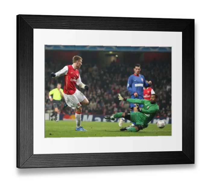 Framed Print : Nicklas Bendtner shoots past Bucuresti keeper Robinson Zapata to score the 2nd Arsenal goal Framed Print : Nicklas Bendtner shoots past Bucuresti keeper Robinson Zapata to score the 2nd Arsenal goal