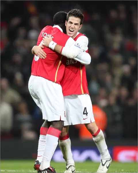 Cesc Fabregas and Kolo Toure (Arsenal) celebrate at the final whistle