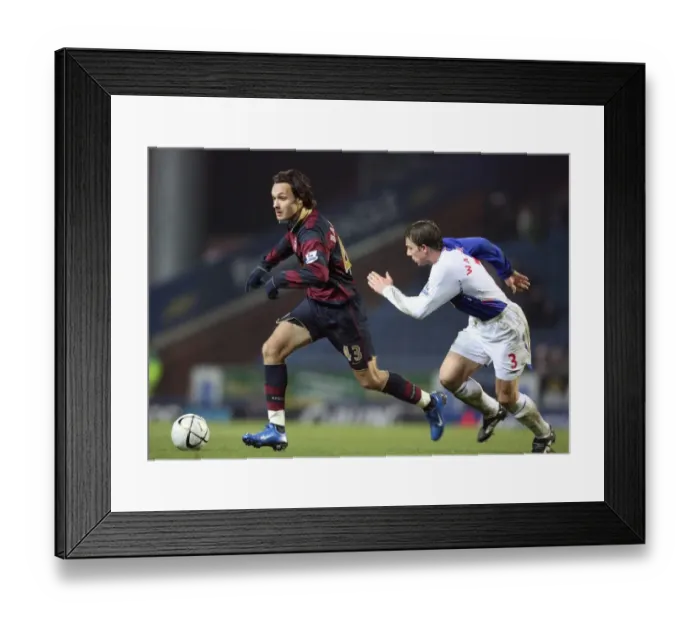 Framed Print : Nacer Barazite and Stephen Warnock Clash in Dramatic Carling Cup Showdown: Arsenal's 3-2 Victory over Blackburn