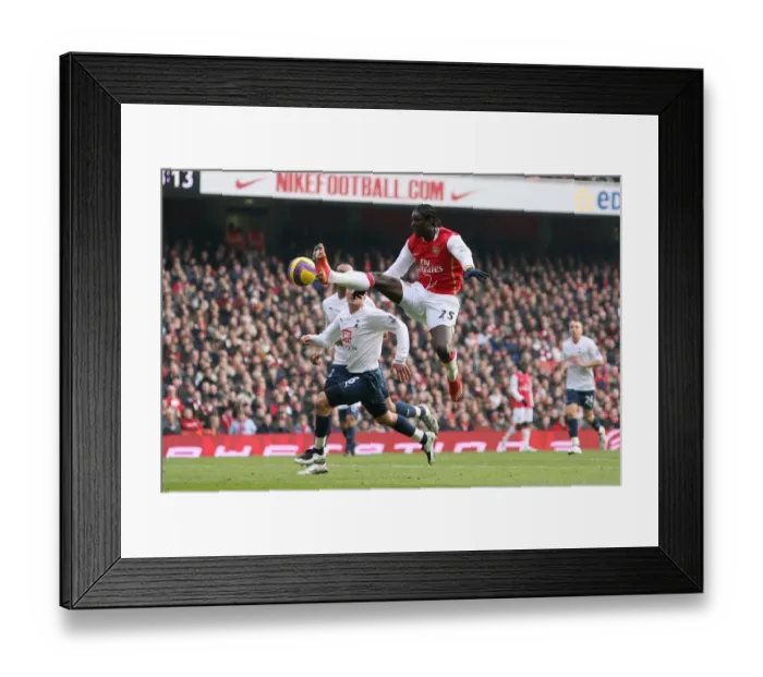 Framed Print : Adebayor's Double Strike: Arsenal Edge Past Tottenham 2-1 in Premier League Rivalry