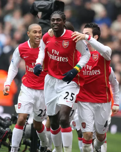 Emmanuel Adebayor celebrates scoring the 1st Arsenal goal with Cesc Fabregas
