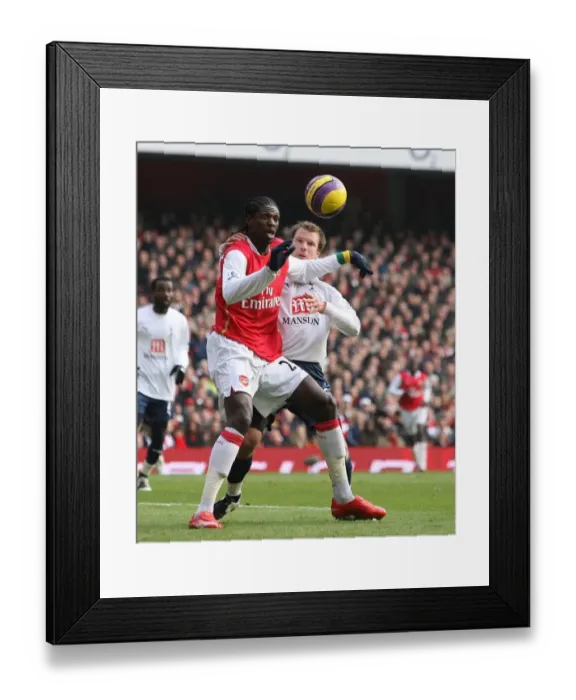 Framed Print : Emmanuel Adebayor (Arsenal) Temu Tainio (Tottenham)