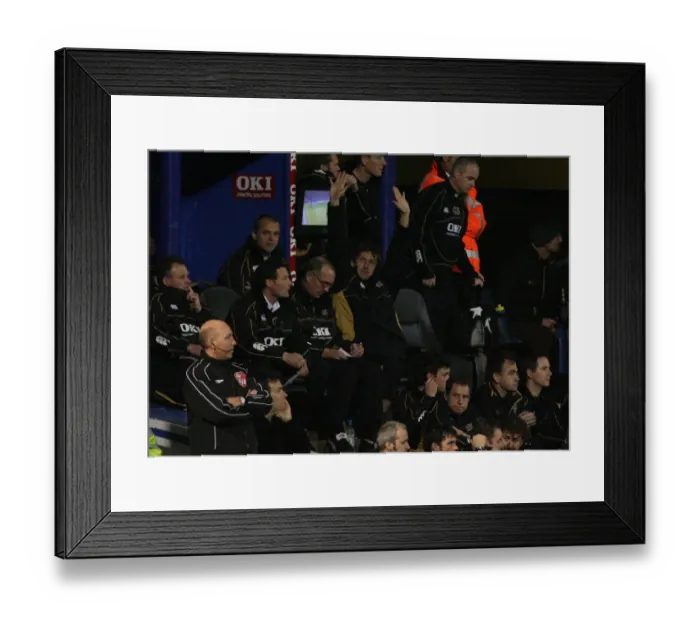 Framed Print : Arsenal legend and Portsmouth coach Tony Adams salutes the Arsenal fans during the match