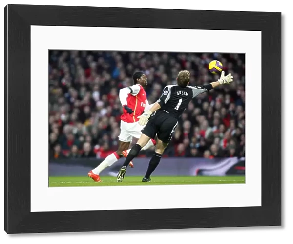 Emmanuel Adebayor rounds Robert Green (West Ham) on his way to scoring Arsenals 2nd goal