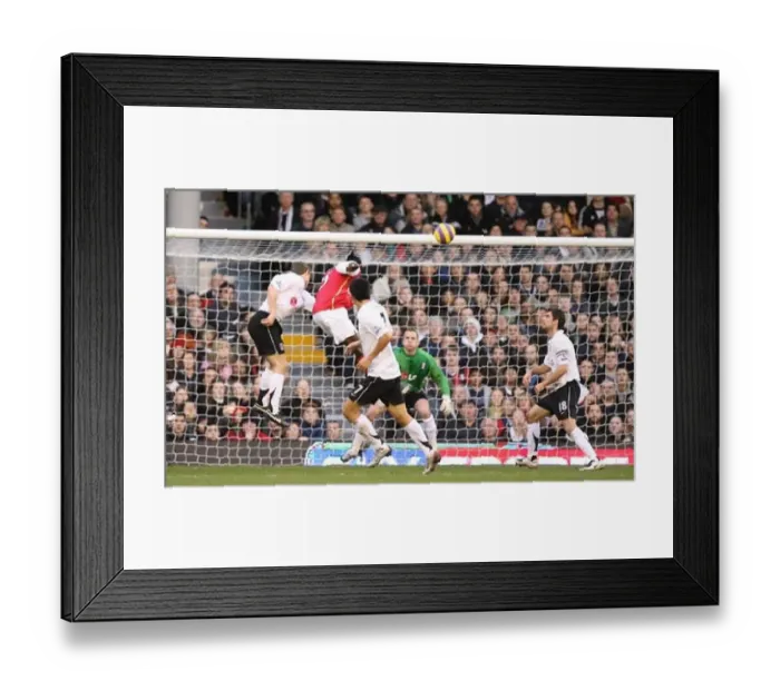  : Emmanuel Adebayor heads past Fulham goalkeeper Antti Niemi to score the 2nd Arsenal goal