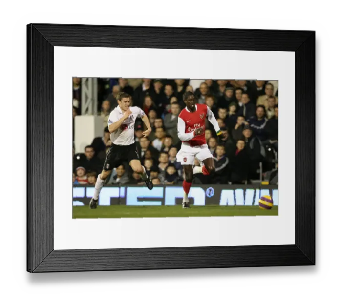 Framed Print : Emmanuel Adebayor (Arsenal) Moritz Volz (Fulham) Framed Print : Emmanuel Adebayor (Arsenal) Moritz Volz (Fulham)