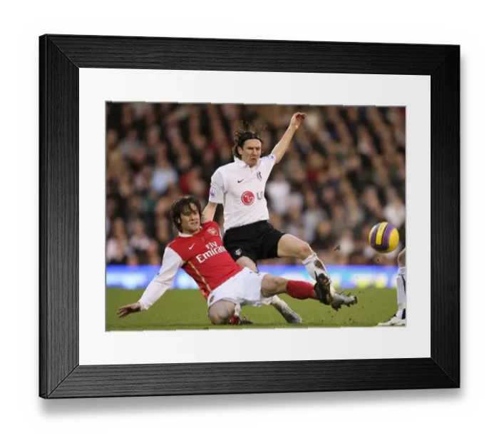  : Triumphant Rivals: Rosicky's Double Strike Against Smertin and Fulham