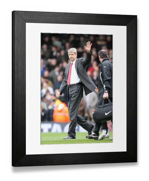 Framed Print : Arsenal manager Arsene Wenger waves to the fans before the match Framed Print : Arsenal manager Arsene Wenger waves to the fans before the match