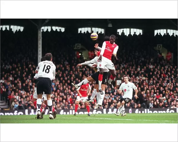 Emmanuel Adebayor scores Arsenals 1st goal under pressure from Dejan Stefanovic