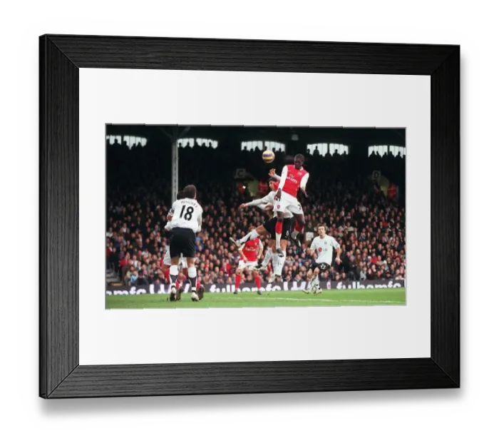Framed Print : Emmanuel Adebayor scores Arsenals 1st goal under pressure from Dejan Stefanovic Framed Print : Emmanuel Adebayor scores Arsenals 1st goal under pressure from Dejan Stefanovic