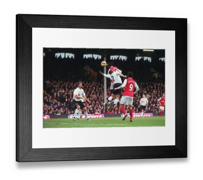 Framed Print : Adebayor's Intense Goal: Arsenal's 2-0 Over Fulham in the Premier League