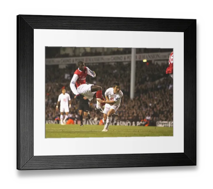 Framed Print : Adebayor's Intense Goal: Arsenal vs. Tottenham in Carling Cup Semi-Final