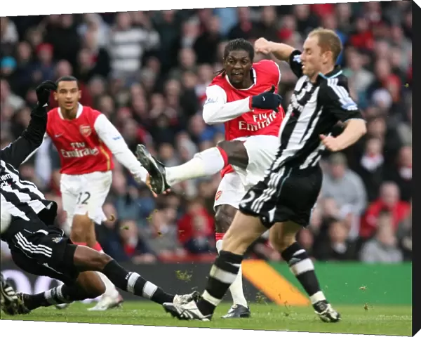 Emmanuel Adebayor shoots past Nicky Butt and Claudio Cacapa to score the 1st Arsenal goal