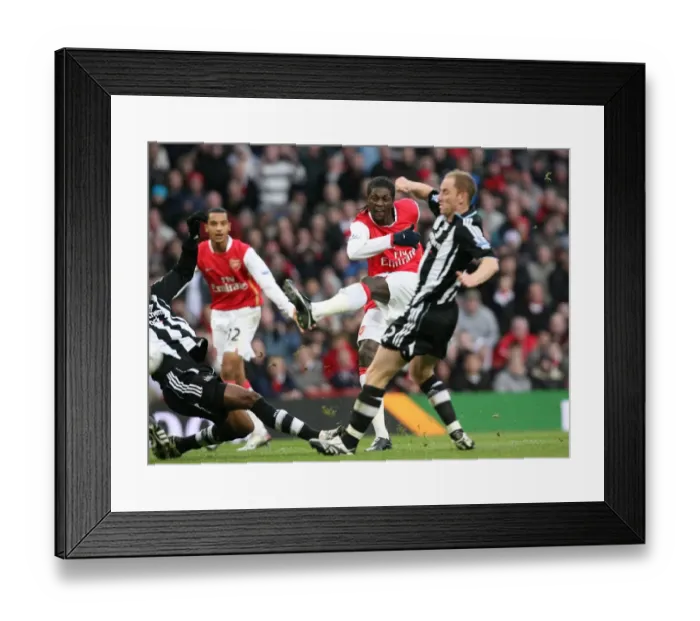 Framed Print : Emmanuel Adebayor shoots past Nicky Butt and Claudio Cacapa to score the 1st Arsenal goal Framed Print : Emmanuel Adebayor shoots past Nicky Butt and Claudio Cacapa to score the 1st Arsenal goal
