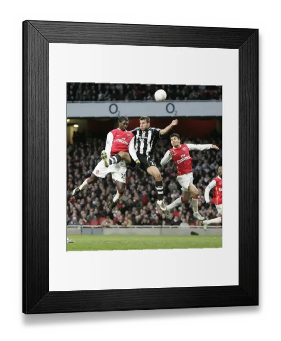 Framed Print : Emmanuel Adebayor and Eduardo (Arsenal) jump with Steven Taylor (Newcastle) Framed Print : Emmanuel Adebayor and Eduardo (Arsenal) jump with Steven Taylor (Newcastle)