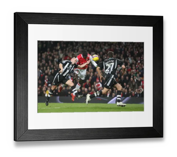 Framed Print : Emmanuel Adebayor heads past Stephen Carr to score the 1st Arsenal goal