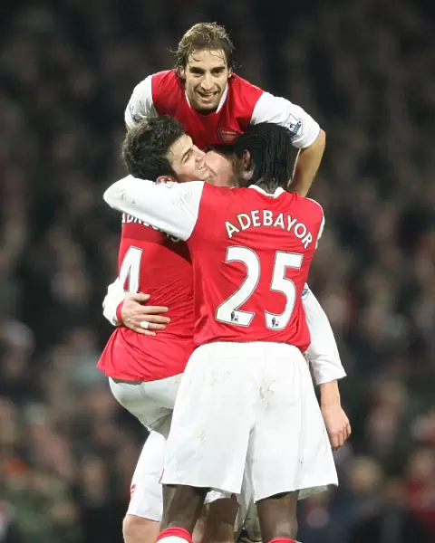 Cesc Fabregas celebrates scoring the 3rd Arsenal goal with Nicklas Bendtner
