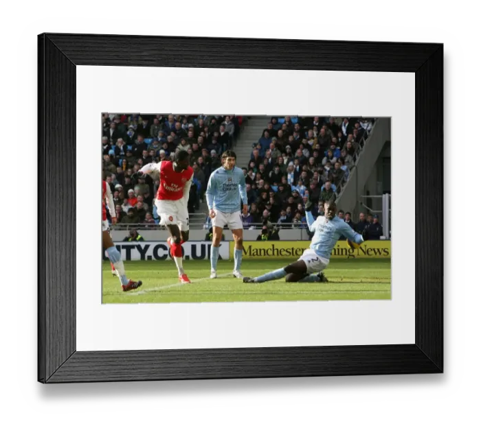 Framed Print : Emmanuel Adebayor shoots past Micah Richards to score the 1st Arsenal goal Framed Print : Emmanuel Adebayor shoots past Micah Richards to score the 1st Arsenal goal