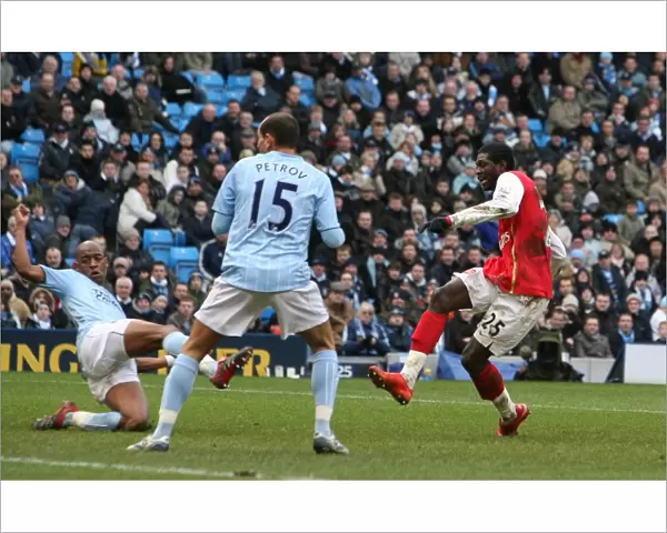 Emmanuel Adebayor shoots past Joe Hart to score his 2nd and Arsenals 3rd goal