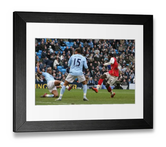 Framed Print : Emmanuel Adebayor shoots past Joe Hart to score his 2nd and Arsenals 3rd goal Framed Print : Emmanuel Adebayor shoots past Joe Hart to score his 2nd and Arsenals 3rd goal