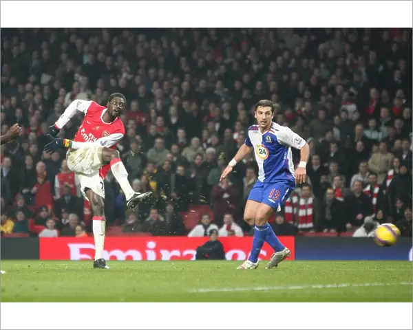 Emmauel Adebayor shoot past Brad Friedel to score the 2nd Arsenal goal