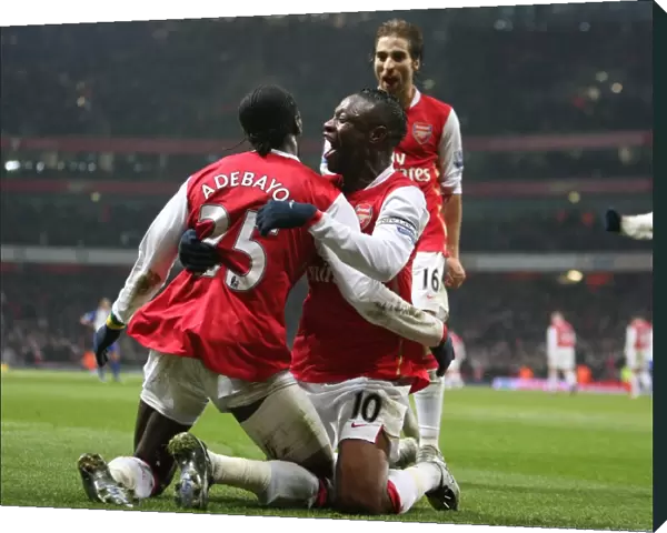 Emmauel Adebayor celebrates scoring the 2nd Arsenal goal with William Gallas