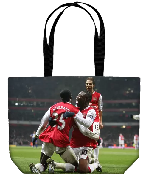 Emmauel Adebayor celebrates scoring the 2nd Arsenal goal with William Gallas