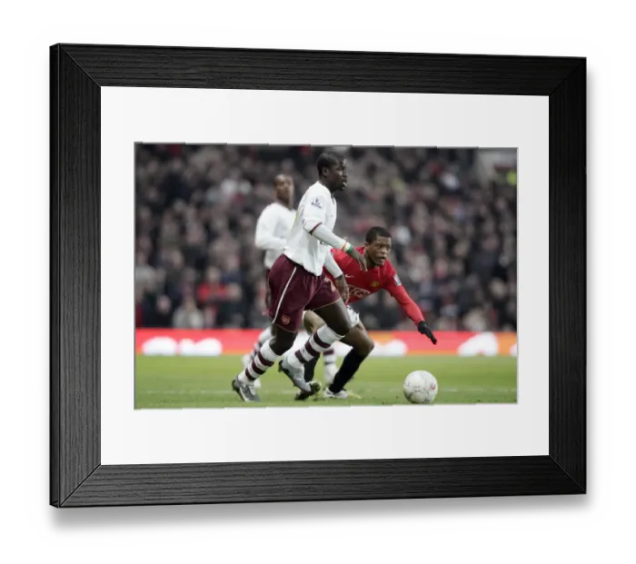 Framed Print : Emmanuel Eboue (Arsenal) Patrice Evra (Man Utd)