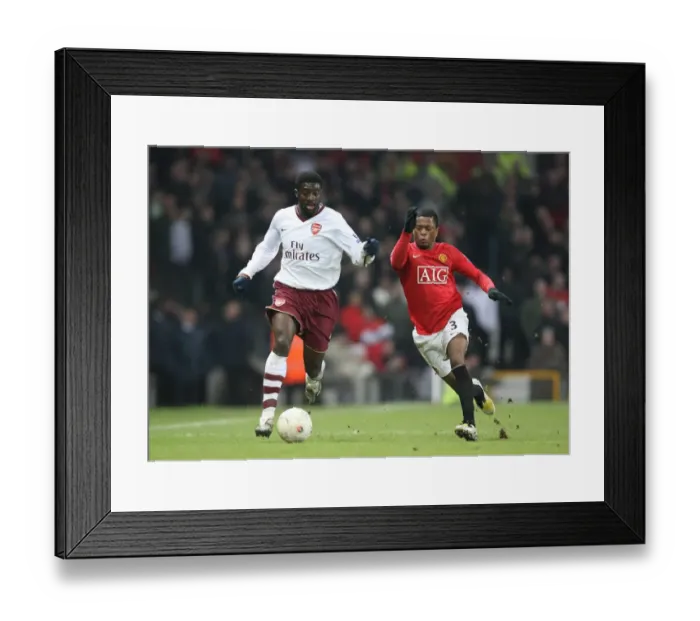Framed Print : Kolo Toure (Arsenal) Patrice Evra (Man Utd)